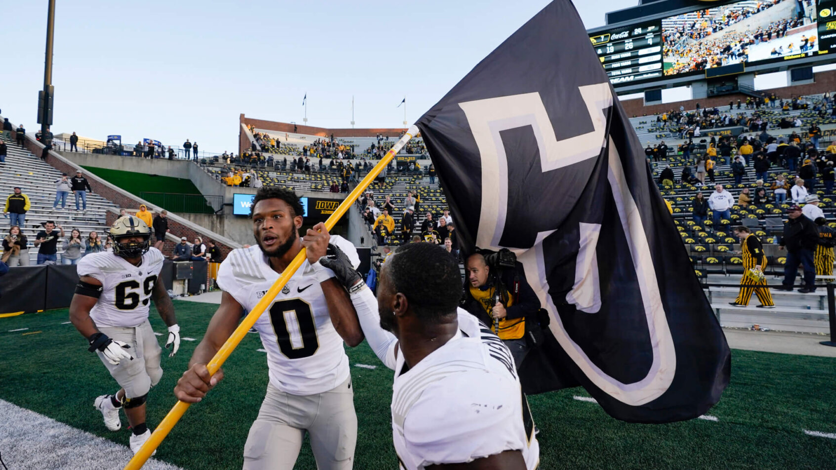 Purdue wide receiver Milton Wright celebrating after an NCAA college football game win.