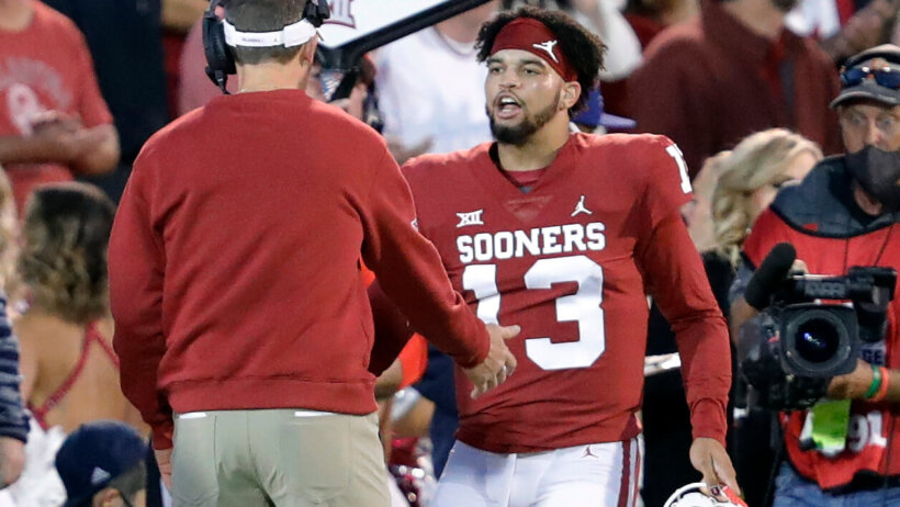 Caleb Williams celebrating with Lincoln Riley on the Oklahoma sideline