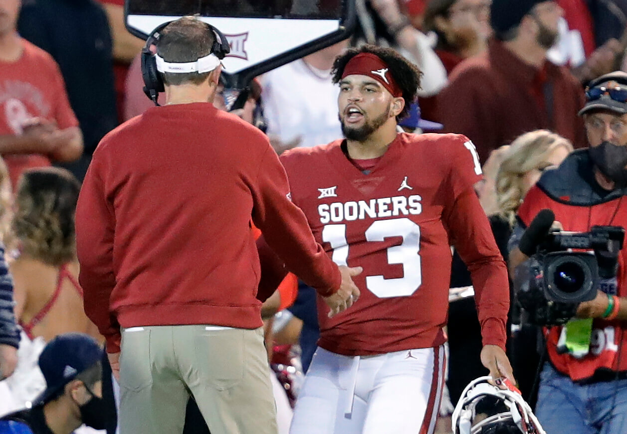 Caleb Williams celebrating with Lincoln Riley on the Oklahoma sideline