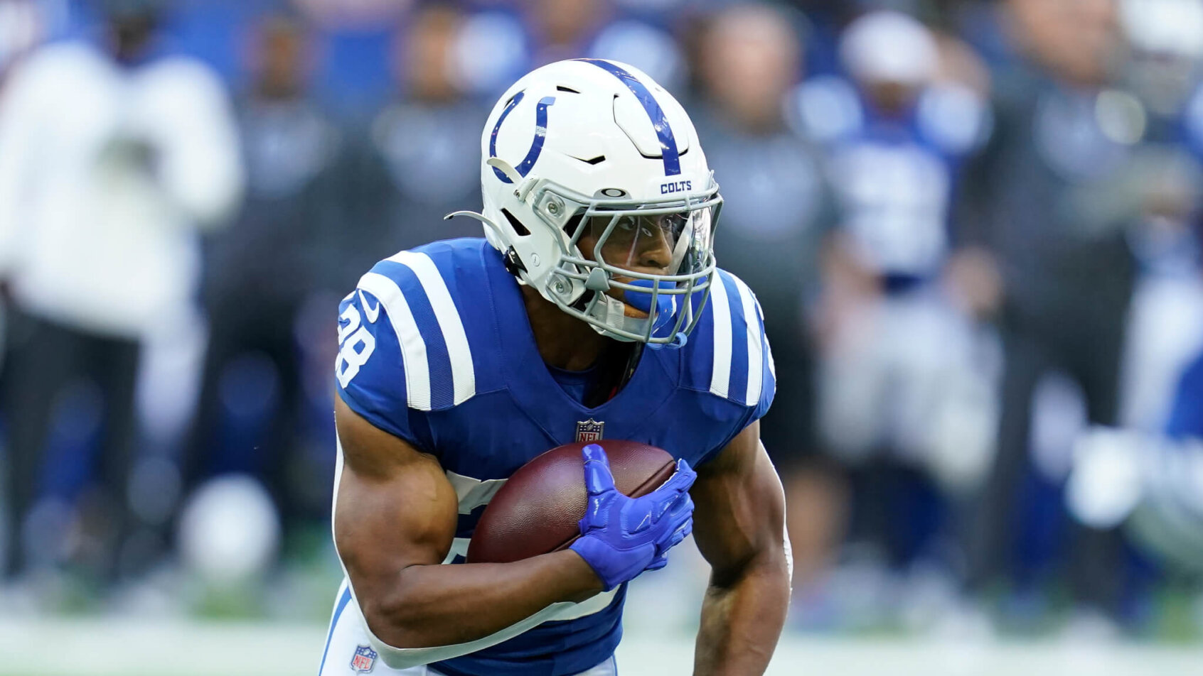 Jonathan Taylor running with football