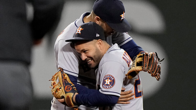 Jose Altuve and Carlos Correa embrace