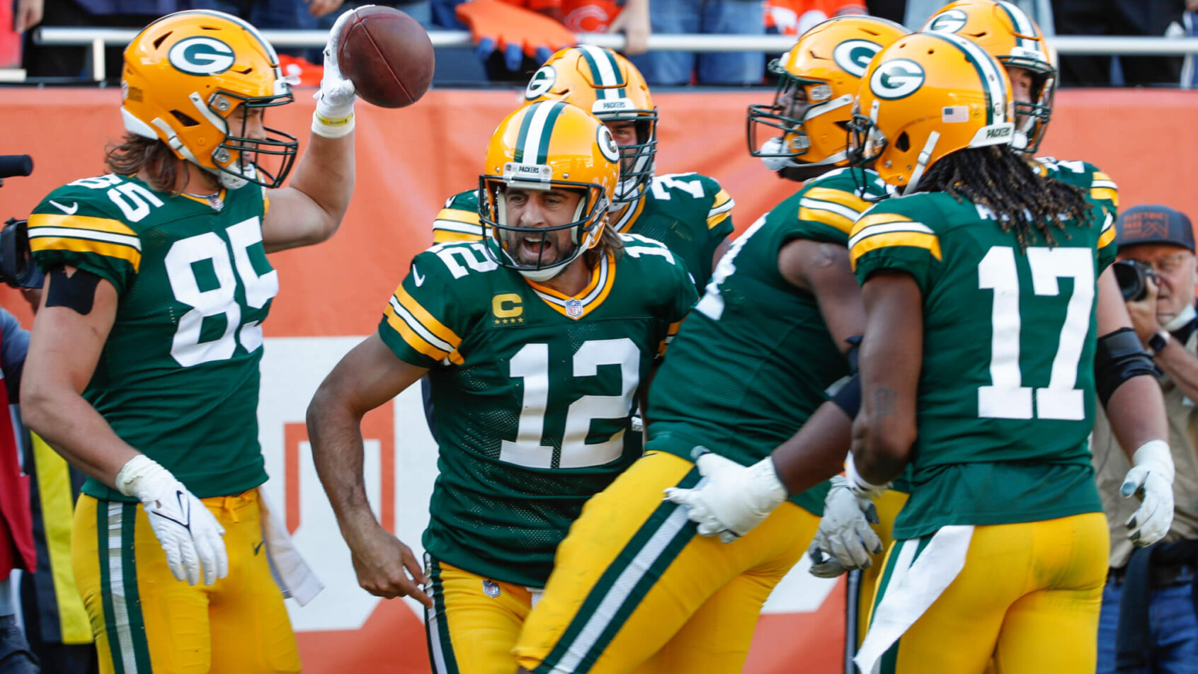 Green Bay Packers players celebrating after scoring a touchdown.