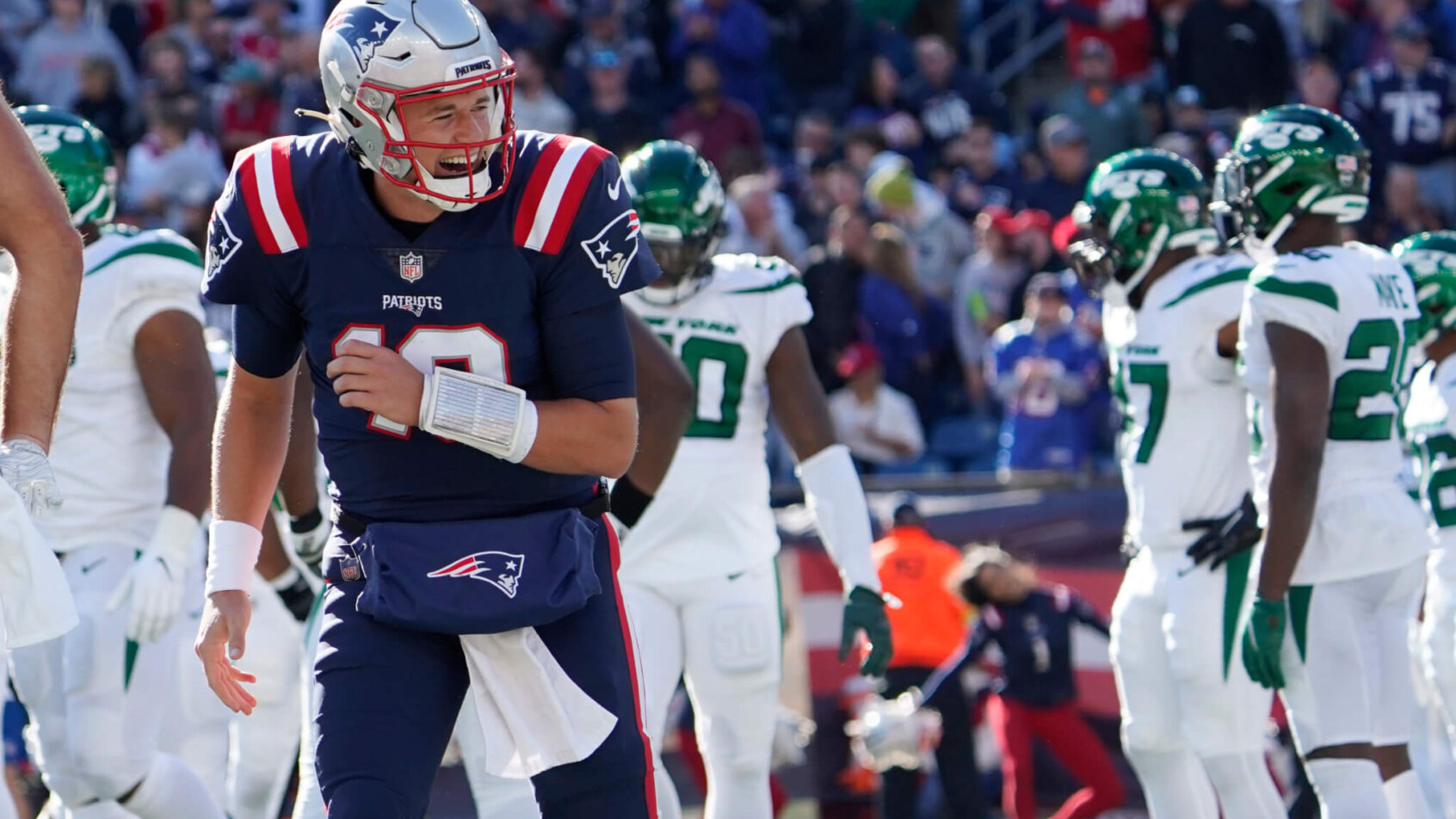 New England Patriots quarterback Mac Jones celebrating after a touchdown.