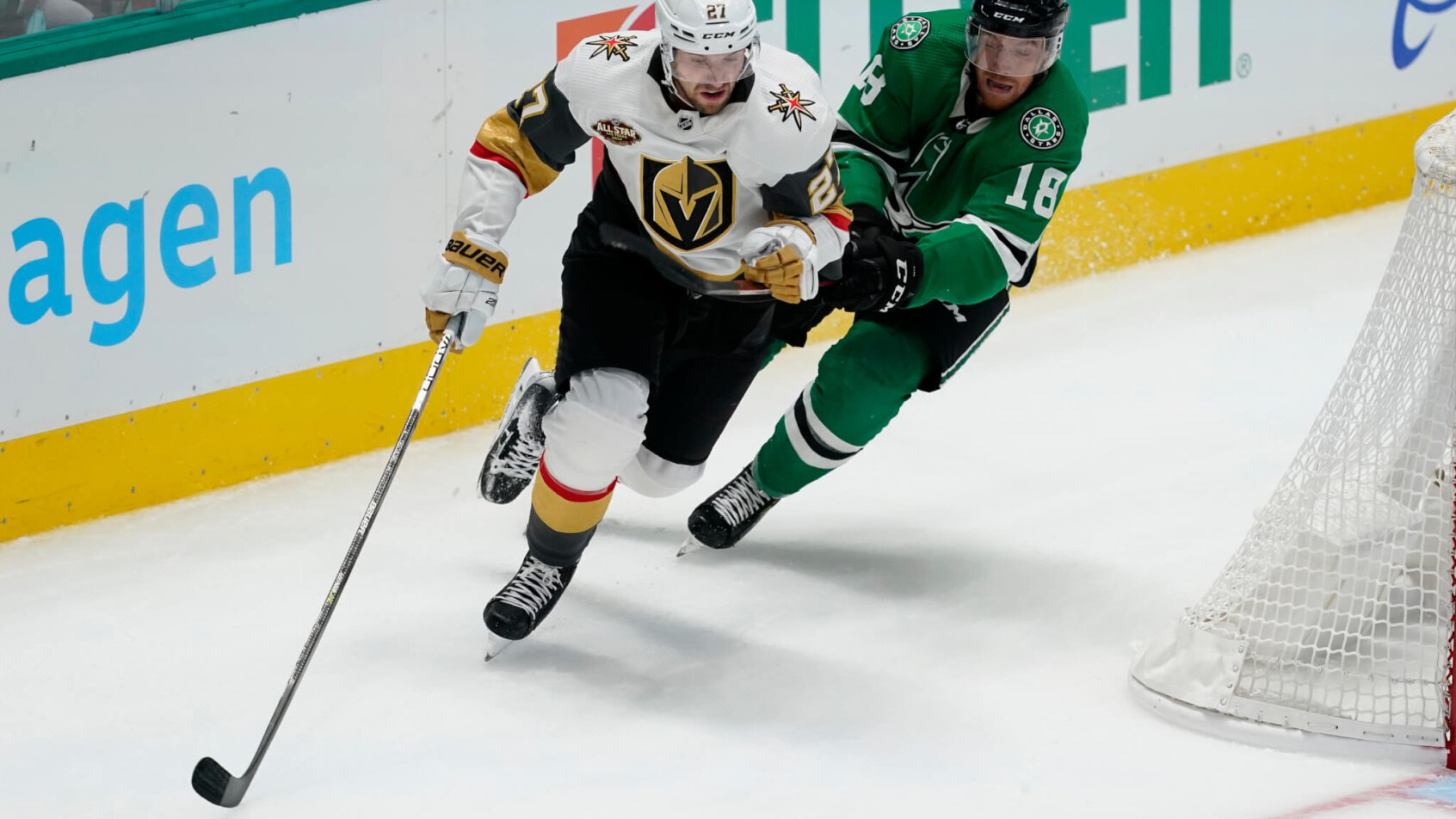 Shea Theodore skating past Michael Raffl