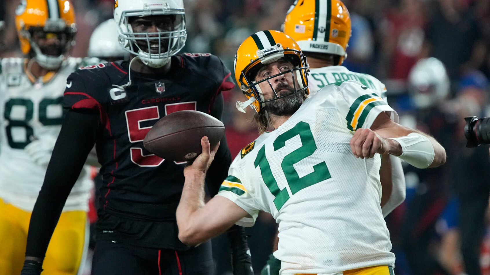 Aaron Rodgers throwing a pass