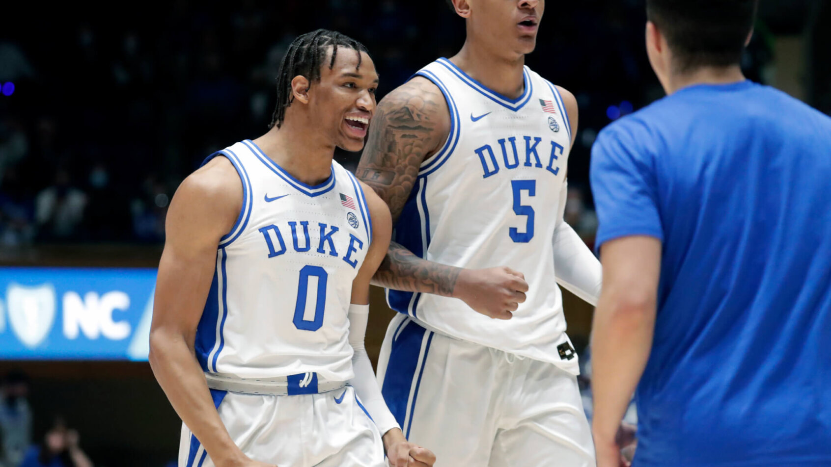 Duke celebrates on their way back to the bench