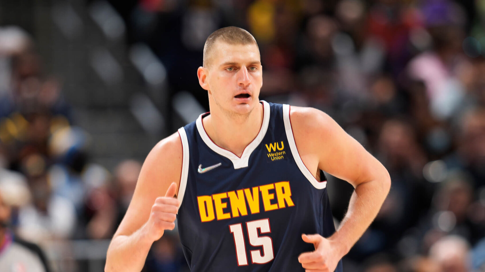 Nikola Jokic races up the court