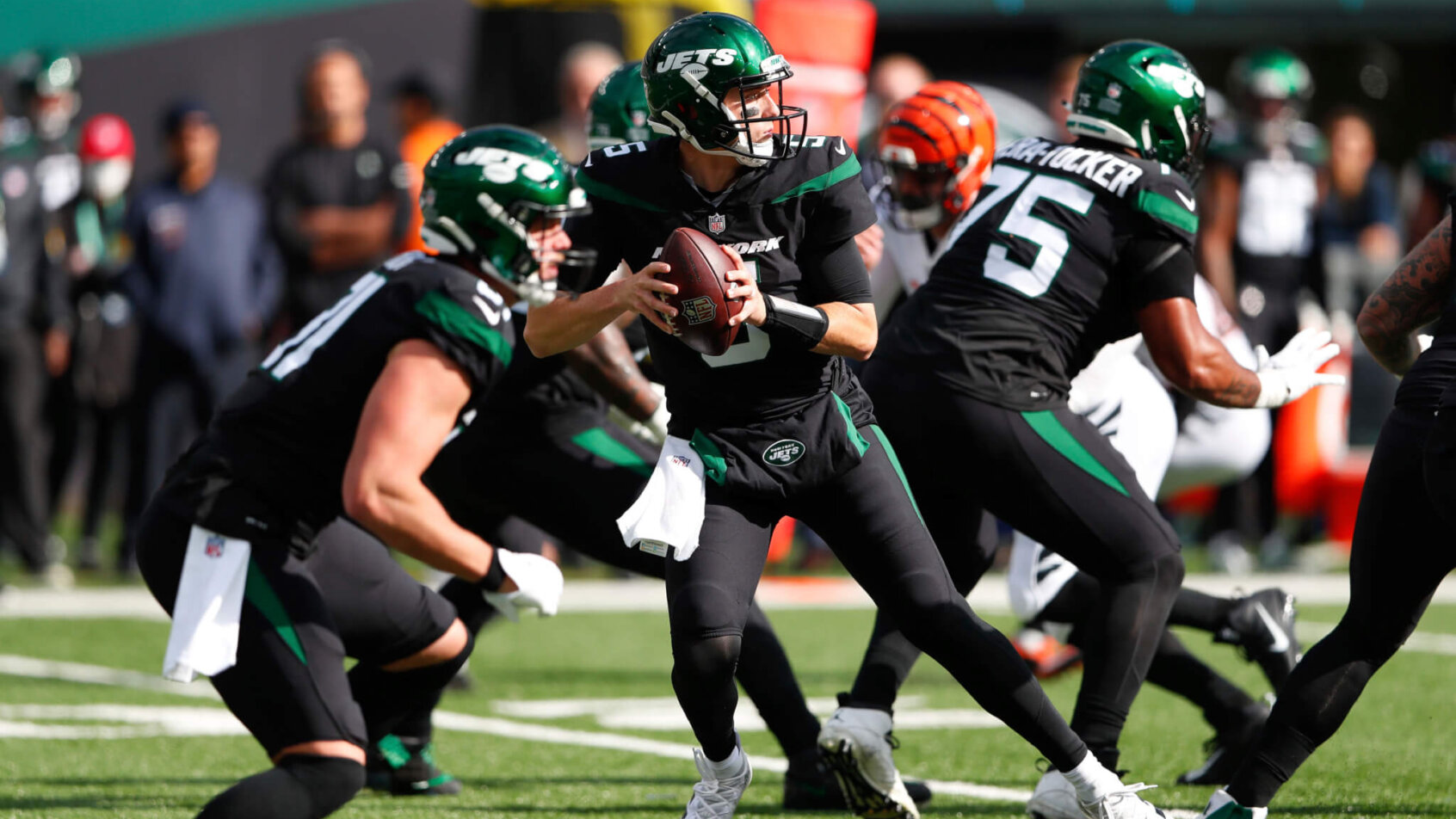 Mike White drops back to pass