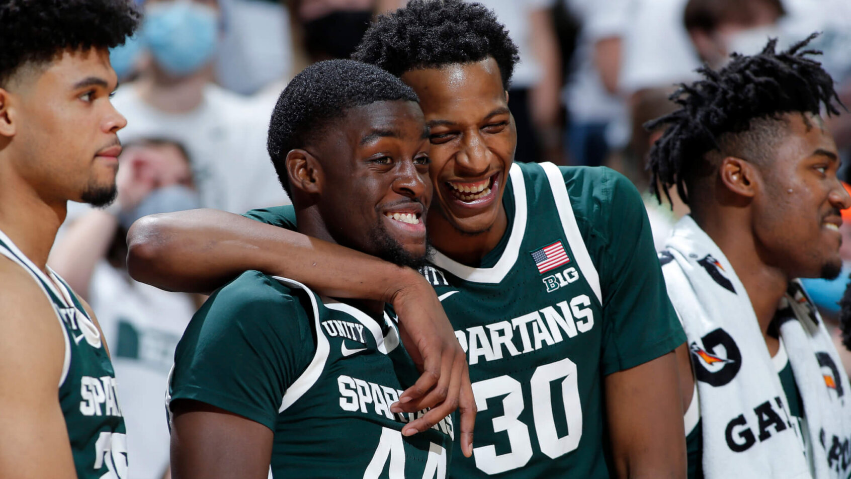 Michigan State's Gabe Brown and Marcus Bingham Jr laughing on the court