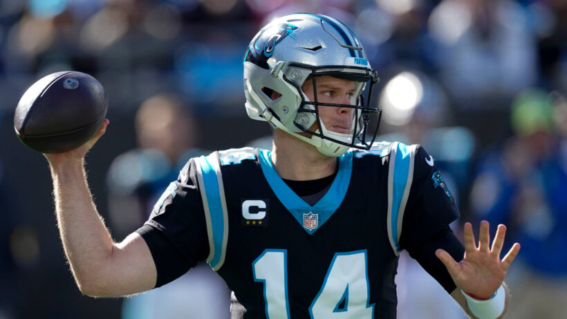 Carolina Panthers quarterback Sam Darnold throwing a pass