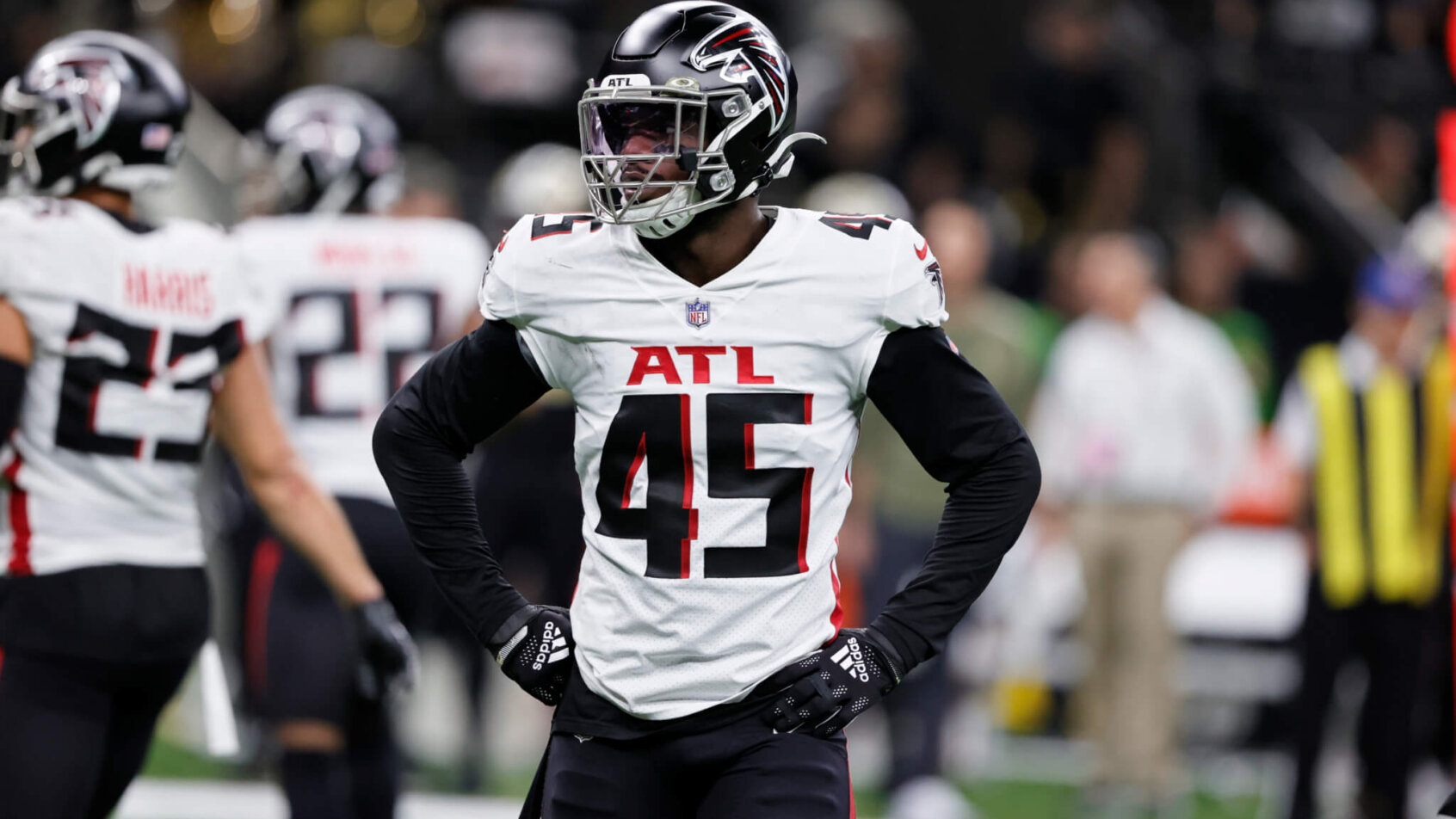 Deion Jones huddles