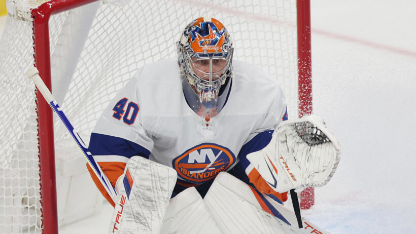 Semyon Varlamov looks on during a faceoff in his own end