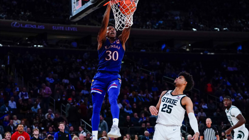 Kansas' Ochai Agbaji dunking the ball