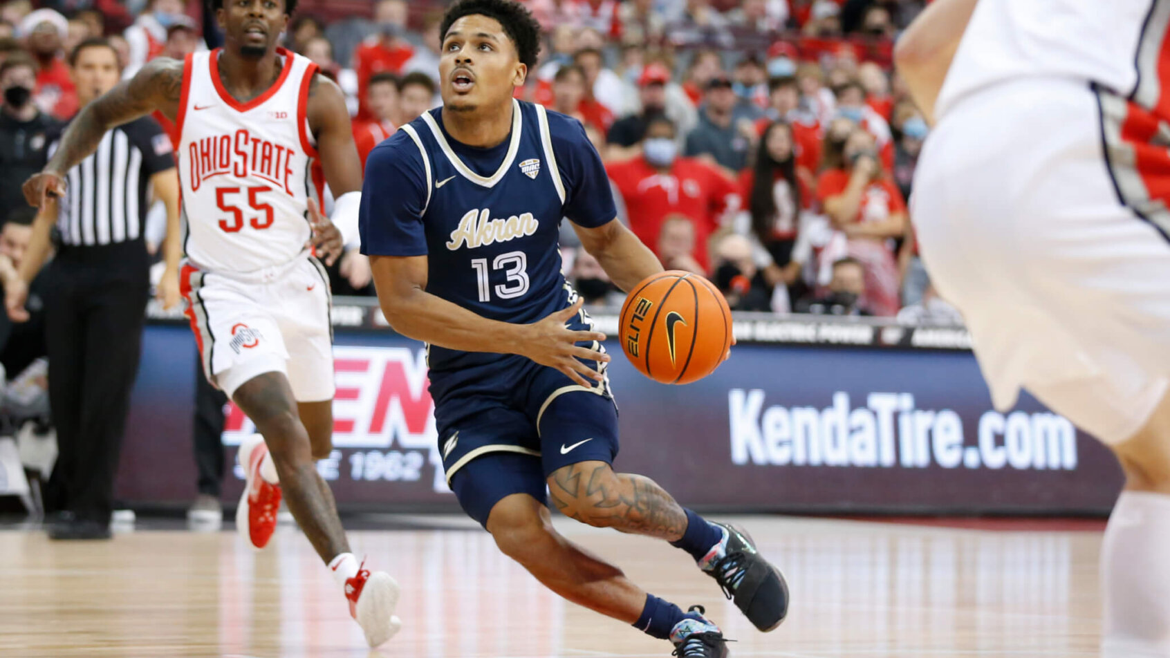 Akron's Xavier Castaneda driving to the hoop