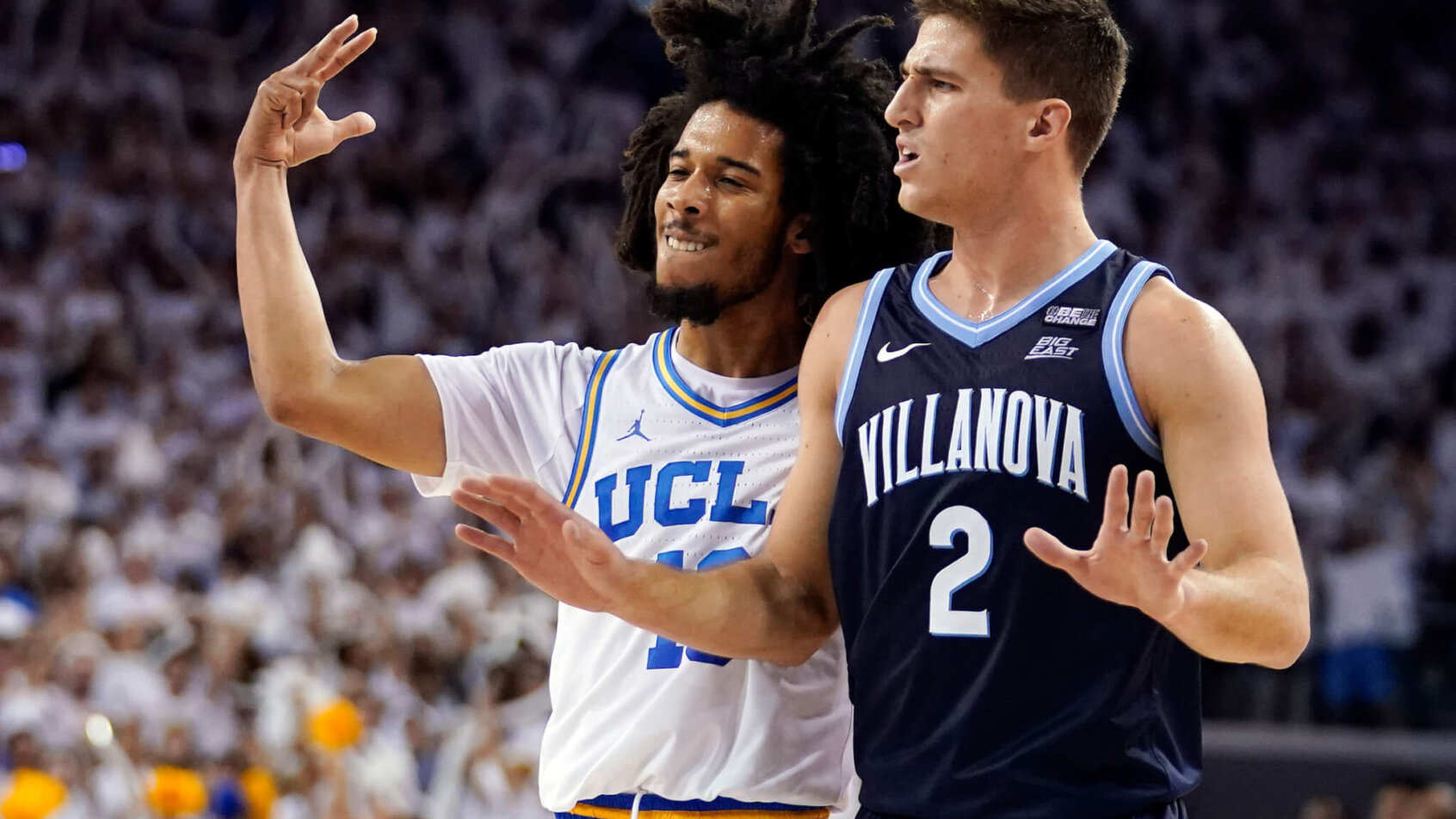 UCLA's Tyger Campbell talking to Villanova's Collin Gillespie