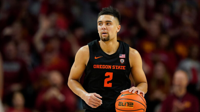 Jarod Lucas brings the ball up court
