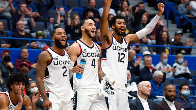 Connecticut's R.J. Cole (2), Tyrese Martin (4) and Tyler Polley (12)