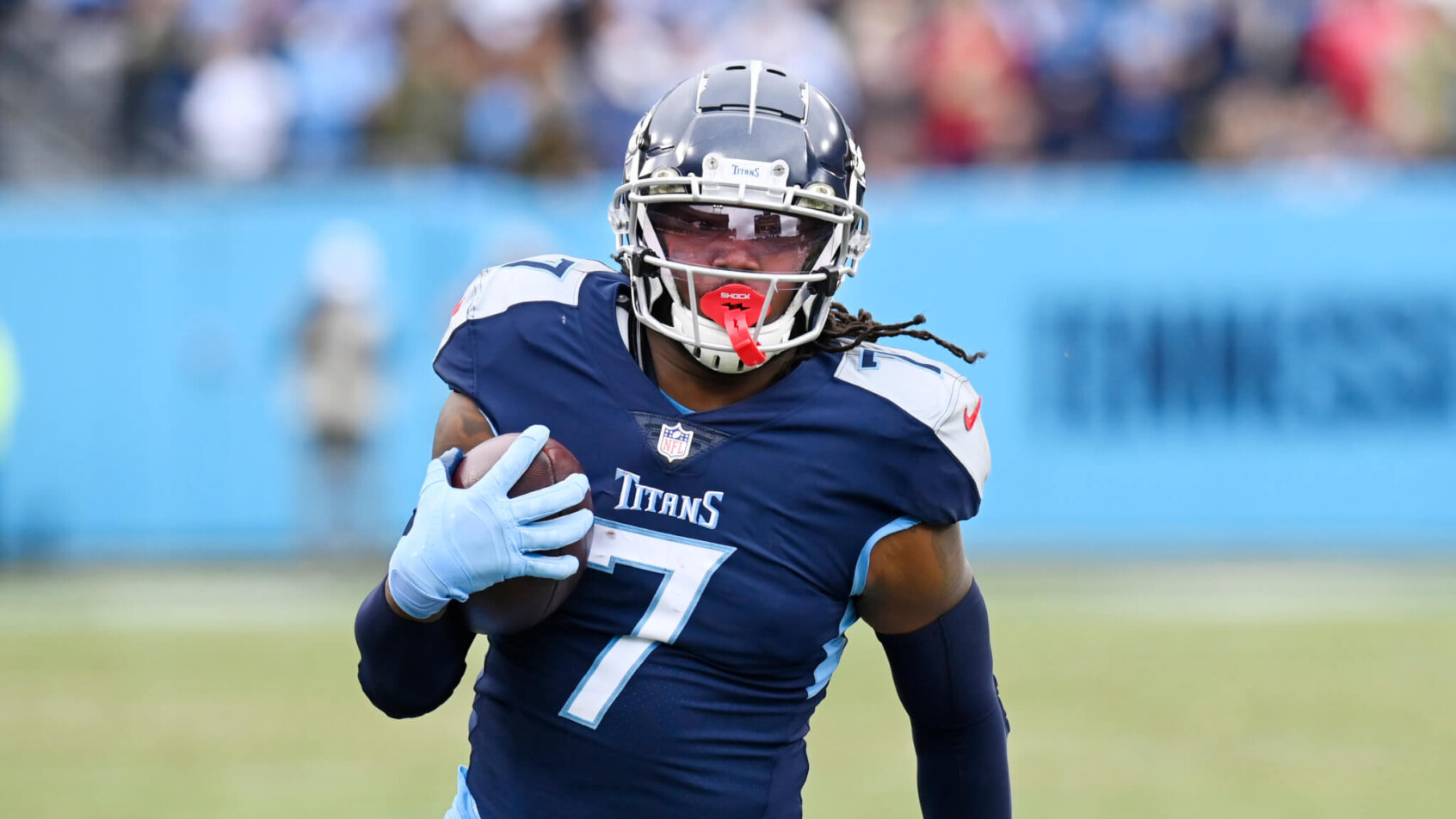 Tennessee Titans running back D'Onta Foreman running with the football during a NFL game.