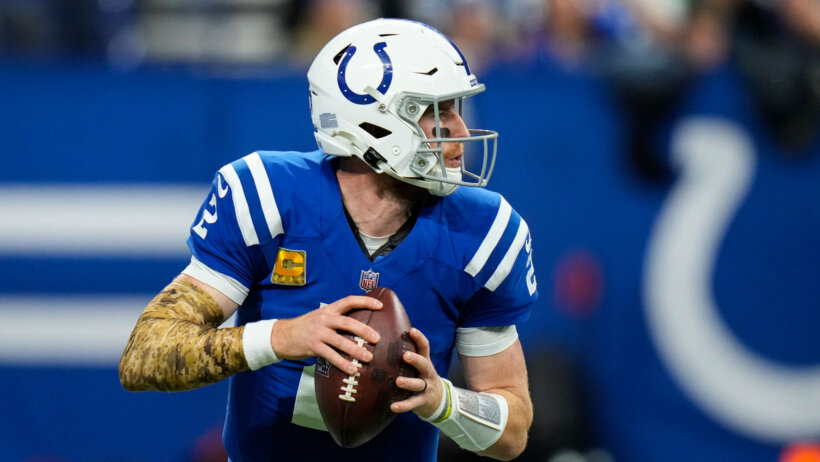 Indianapolis Colts quarterback Carson Wentz throwing the ball during an NFL football game.