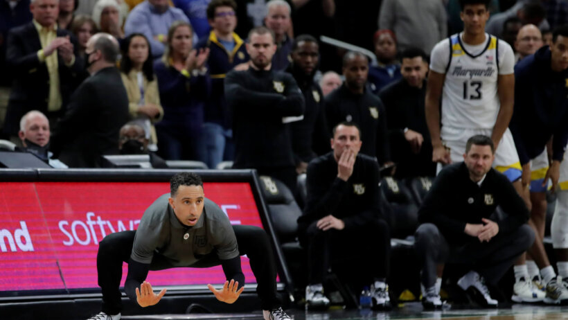 Marquette head coach Shaka Smart slapping the floor