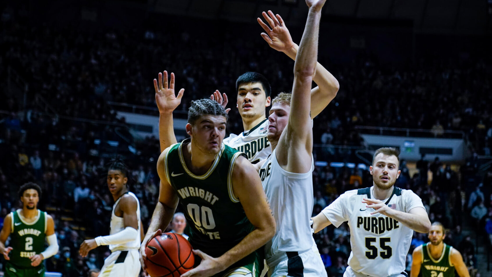 Wright State forward Grant Basile holds the ball under the hoop