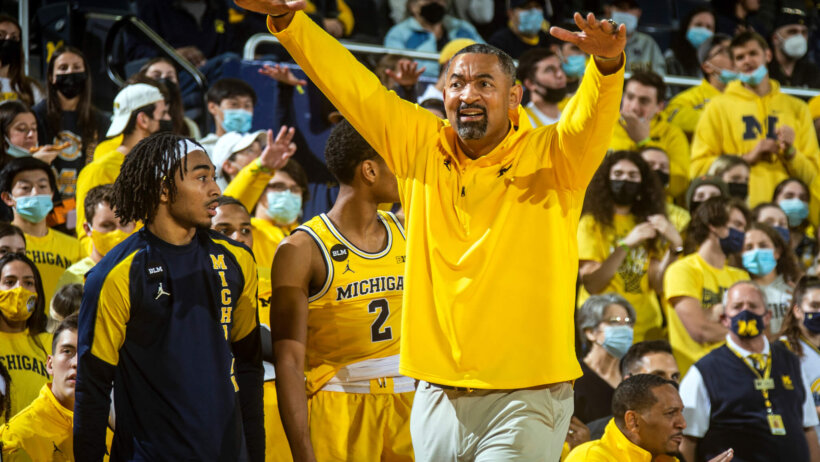 Michigan head coach Juwan Howard motioning to his players