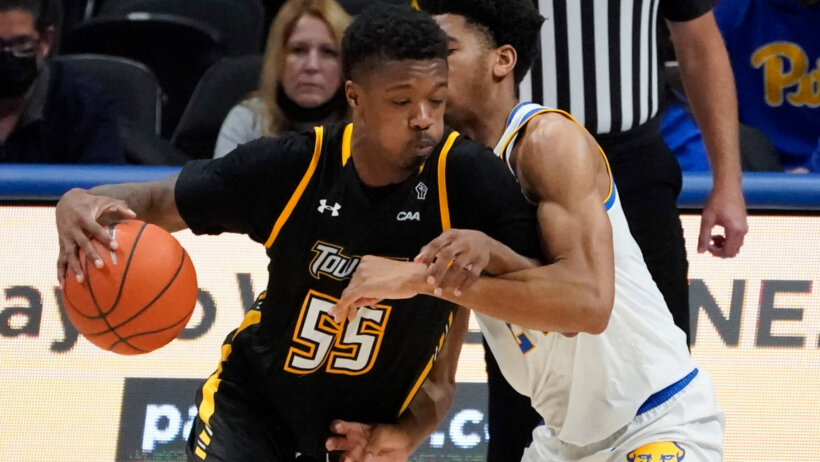 Towson's Cameron Holden driving to the hoop