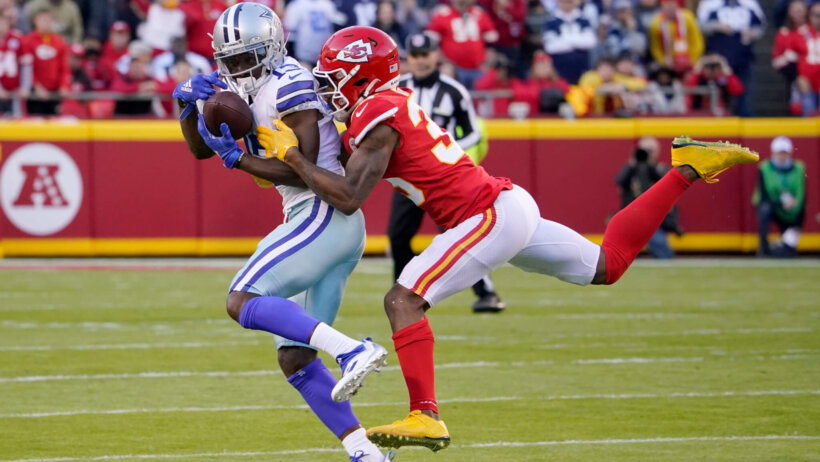 Michael Gallup catches a pass with a defender all over him