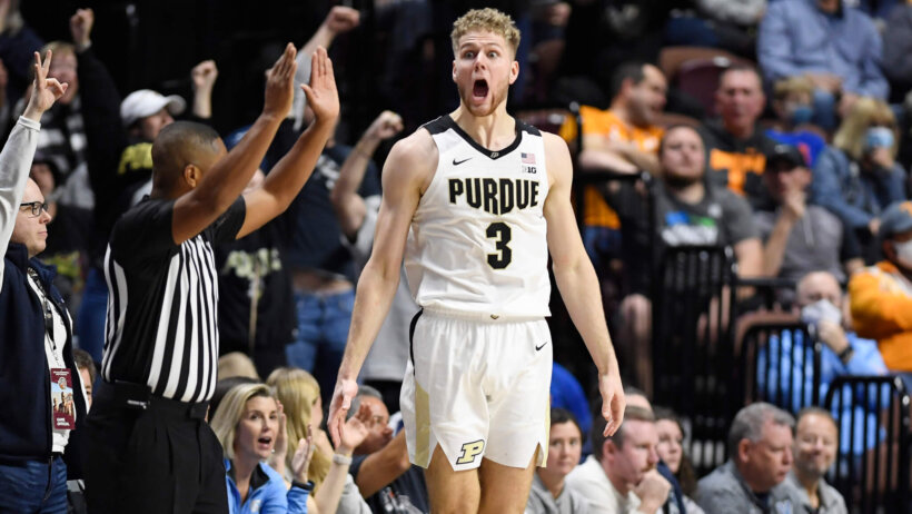 Caleb Furst celebrates a three