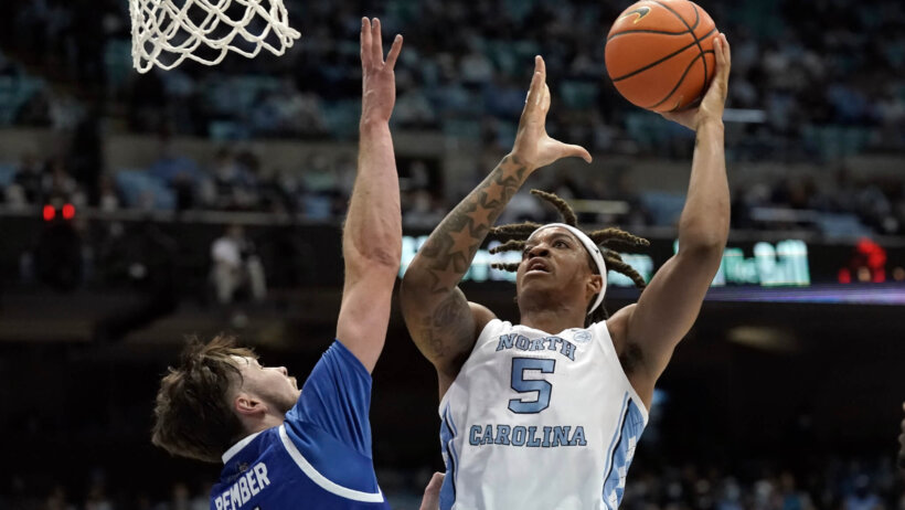 North Carolina forward Armando Bacot going up for a shot under the basket