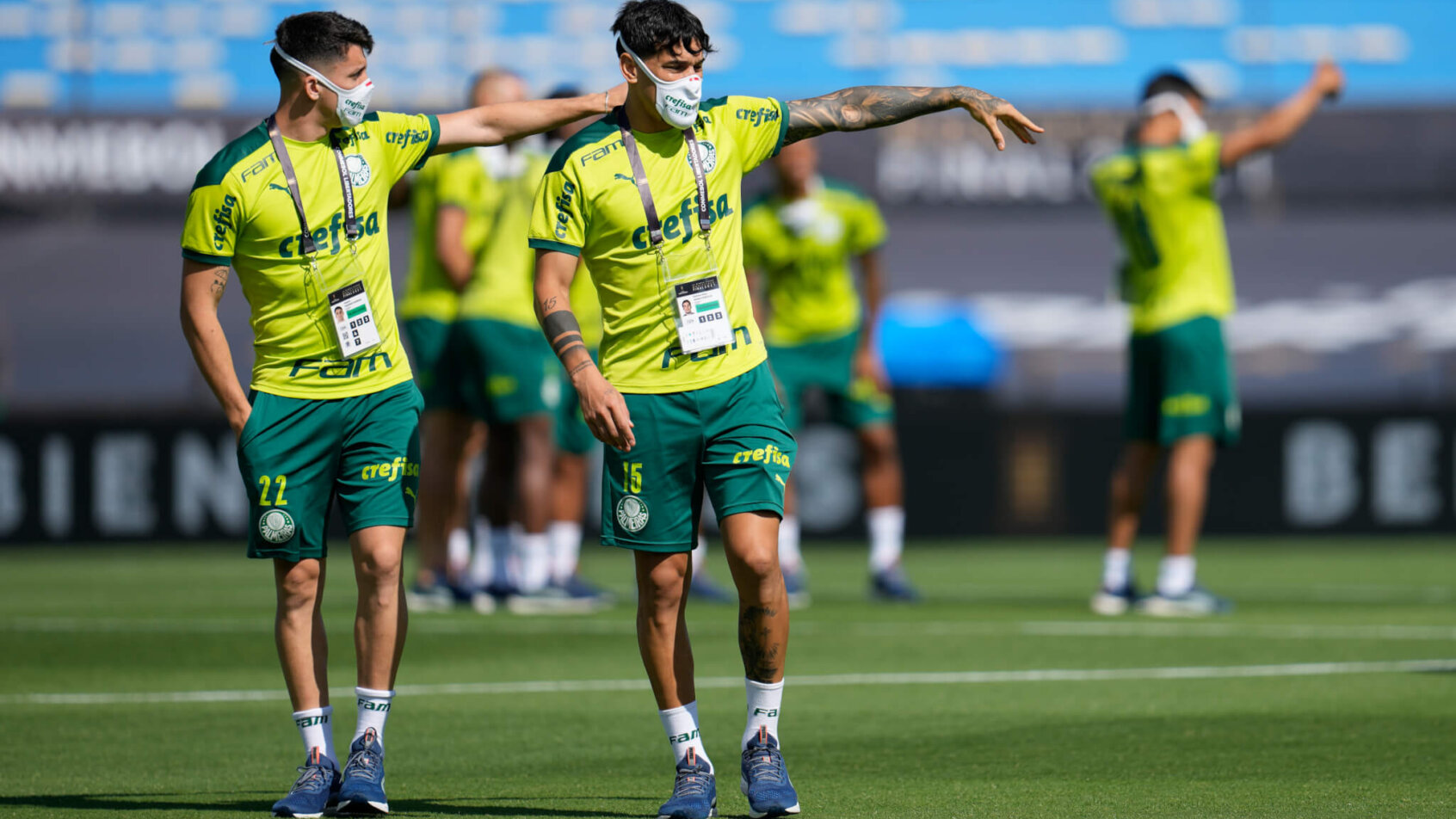 Palmeiras players walking pitch, wearing masks