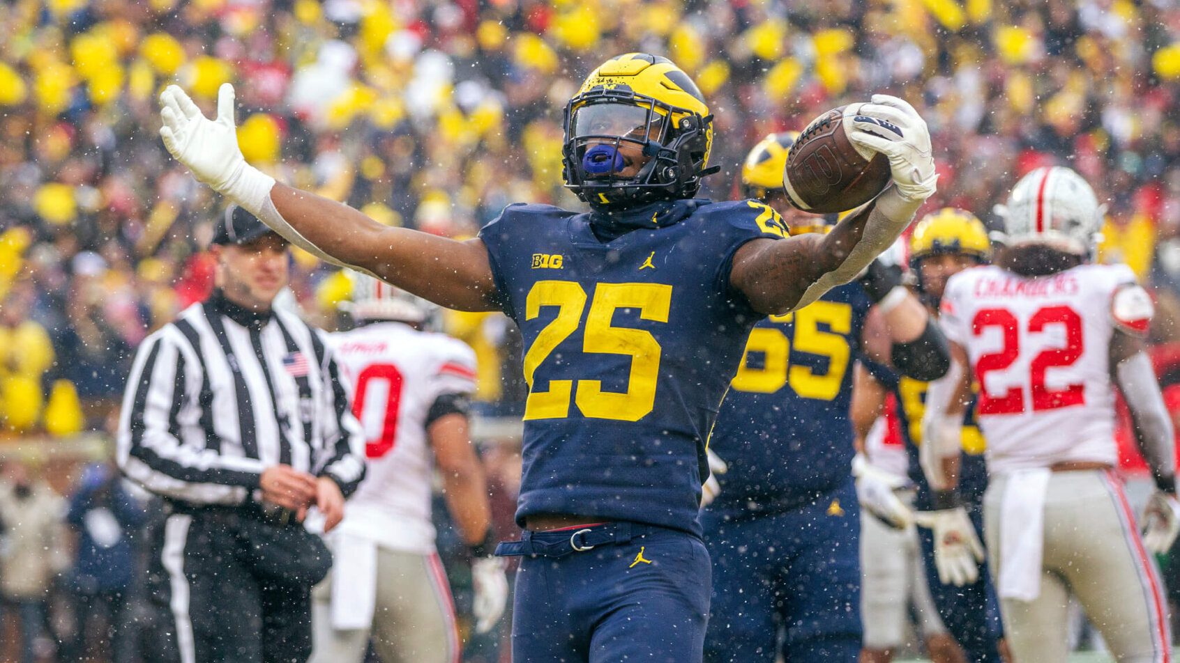 Michigan running back Hassan Haskins celebrating a touchdown