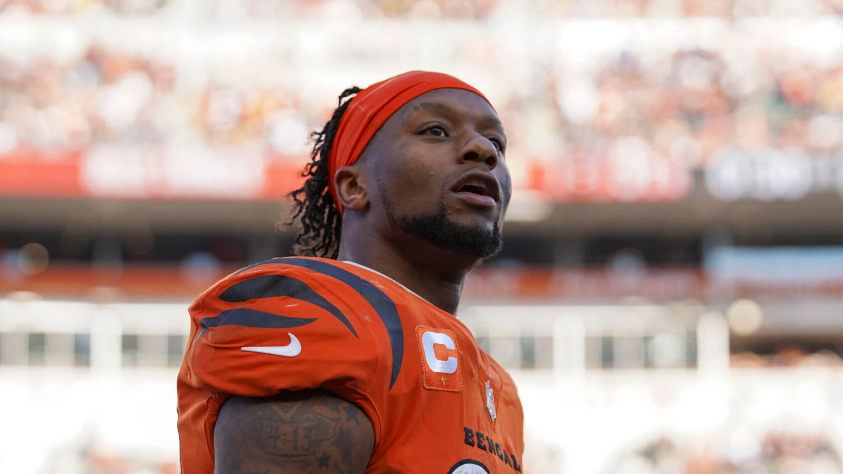 Cincinnati Bengals running back Joe Mixon standing on the field during a football game.