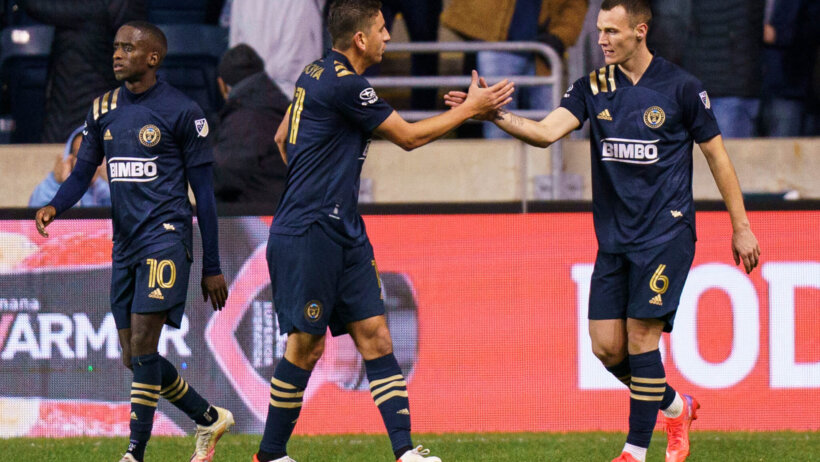 Players celebrate goal