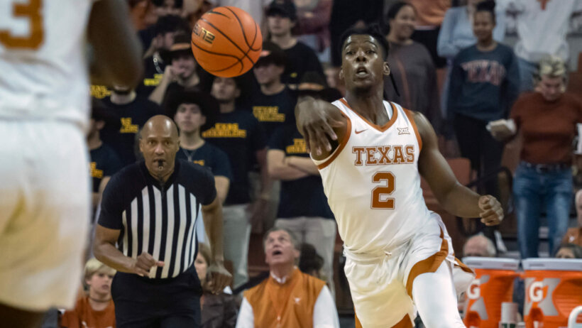 Texas guard Marcus Carr making a pass