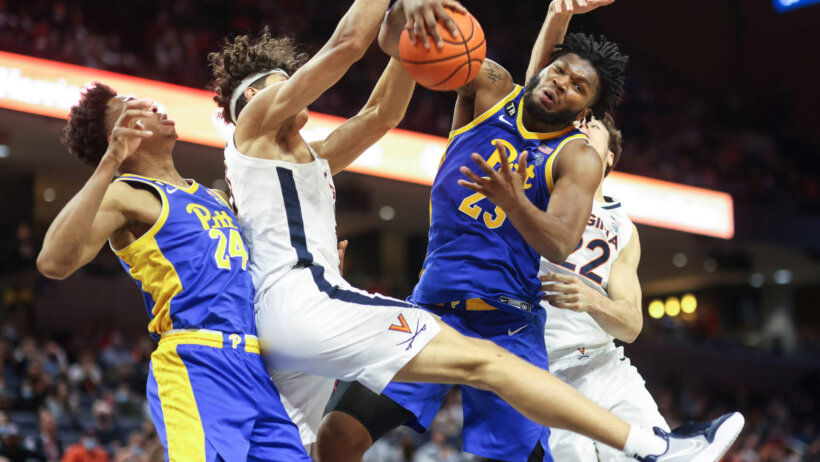 Pittsburgh forward John Hugley grabbing a rebound