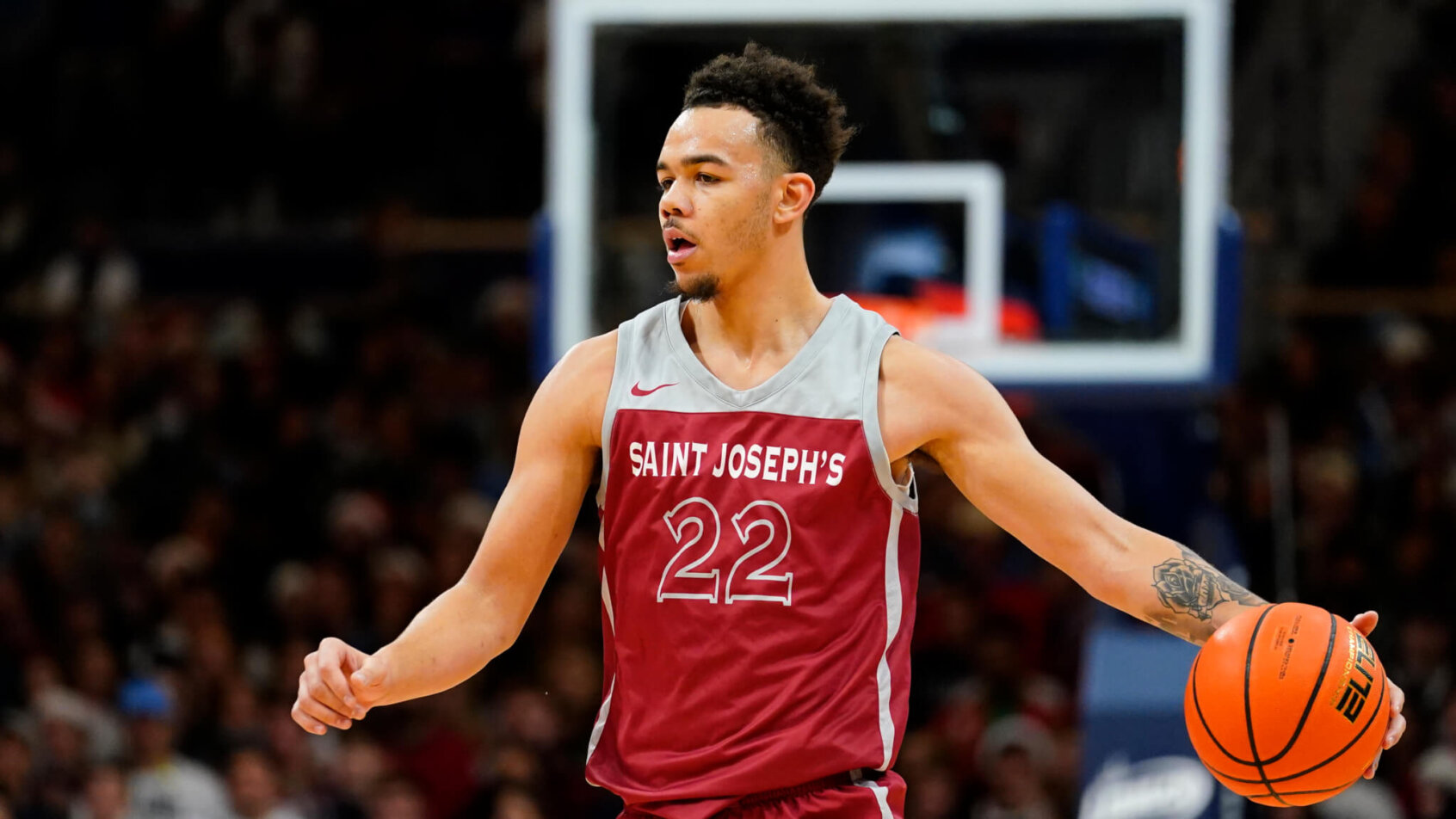 Jordan Hall brings the ball up court