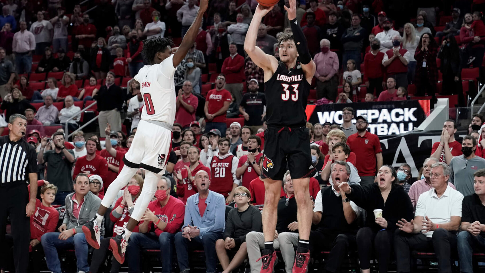 Louisville forward Matt Cross shooting a three