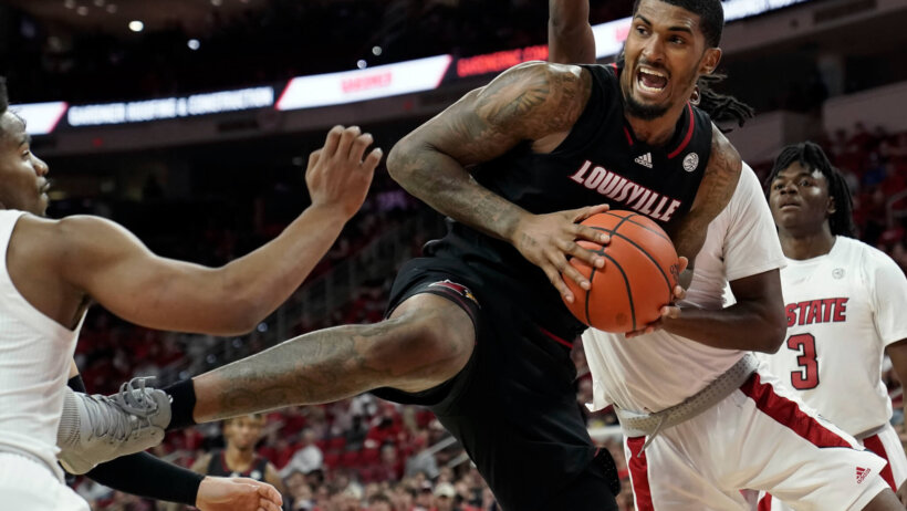 Louisville forward Malik Williams grabbing a rebound