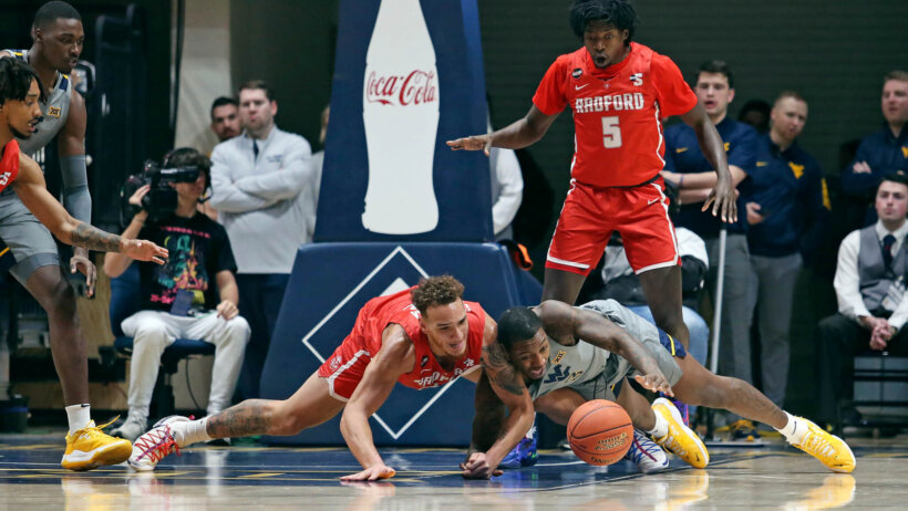 Radford center Lewis Djonkam fighting for a loose ball