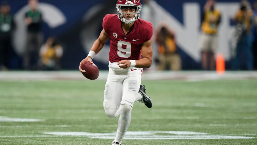 Alabama quarterback Bryce Young running with the football