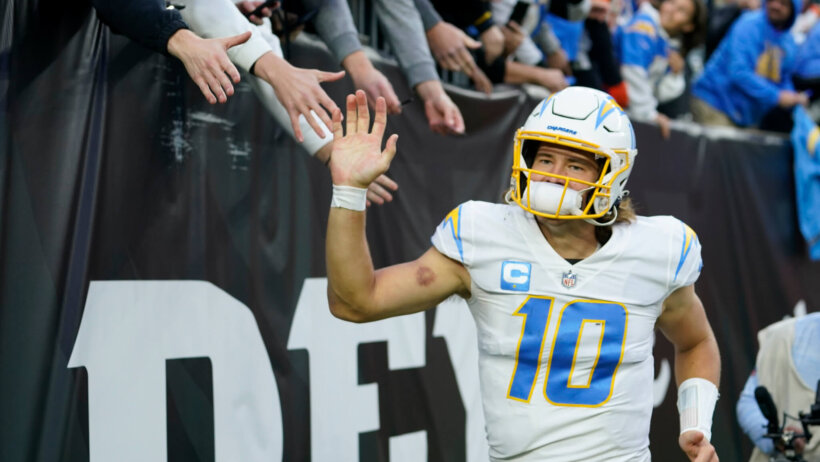 Justin Herbert high-fives fans