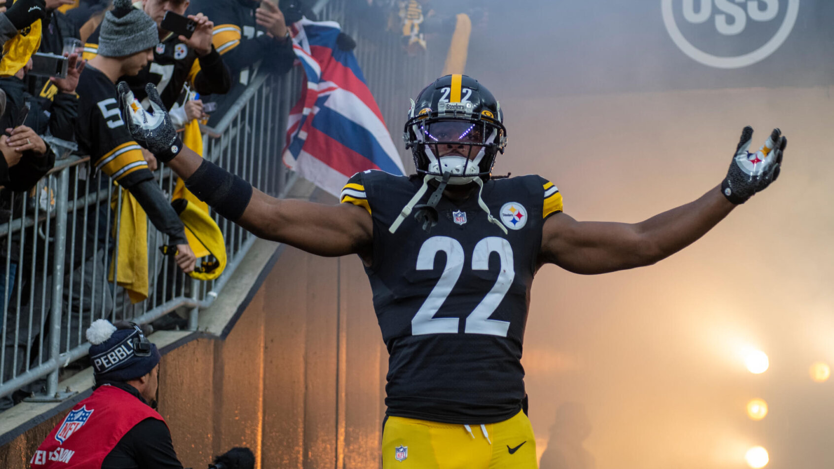 Najee Harris walking out of tunnel arms out