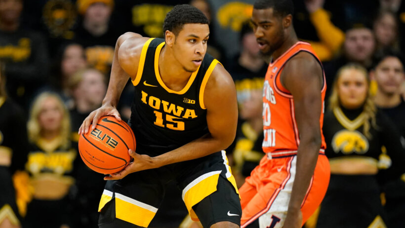 Iowa forward Keegan Murray shields the ball from a defender