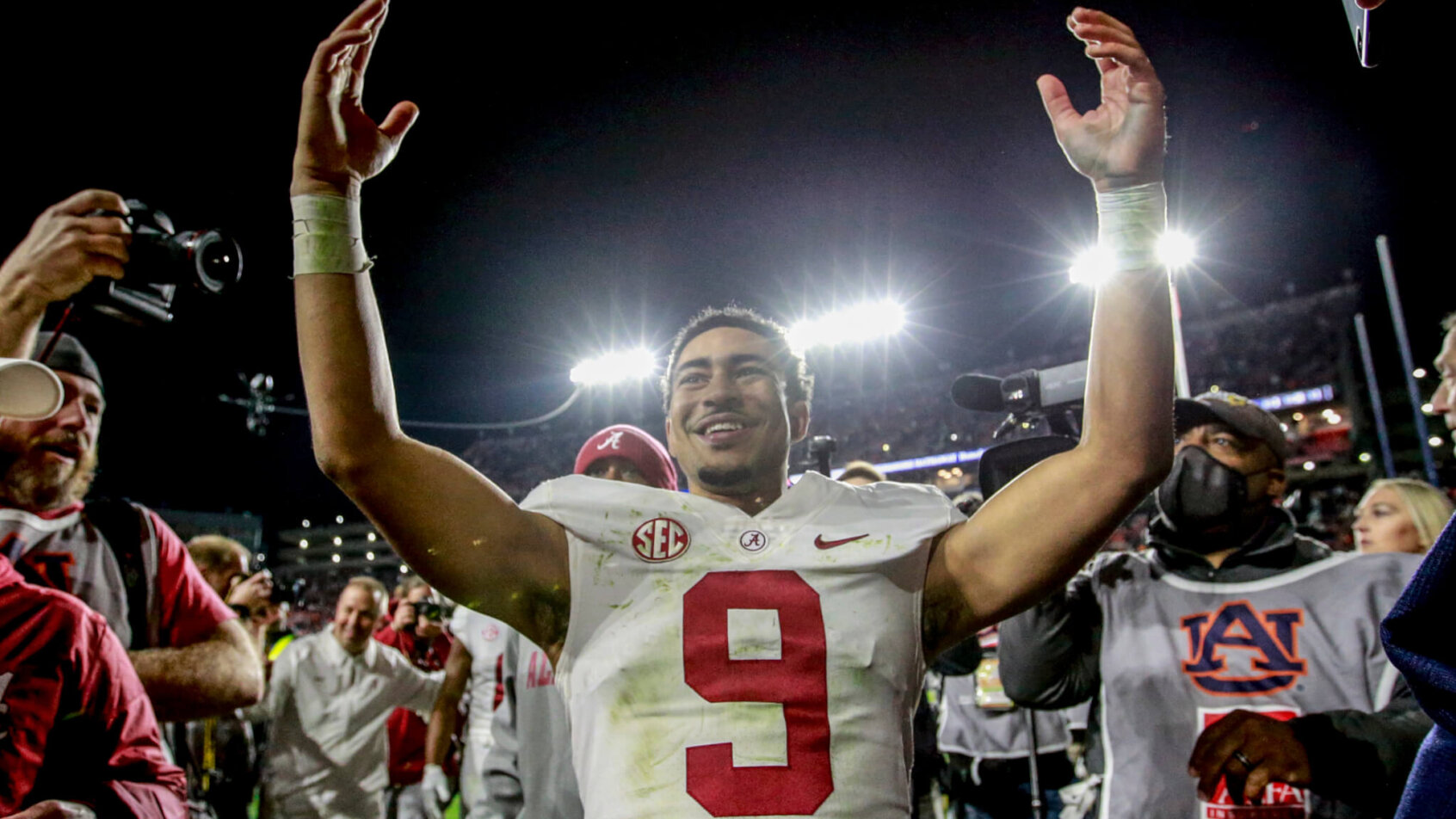 Bryce Young celebrates an OT win