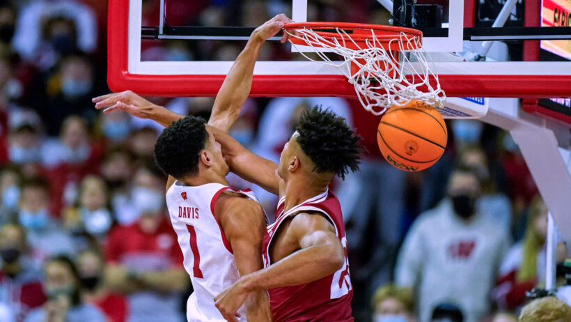 Johnny Davis dunks over defender