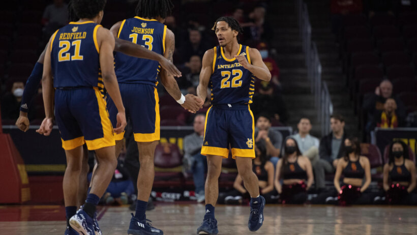 UC Irvine guard DJ Davis celebrating a basket
