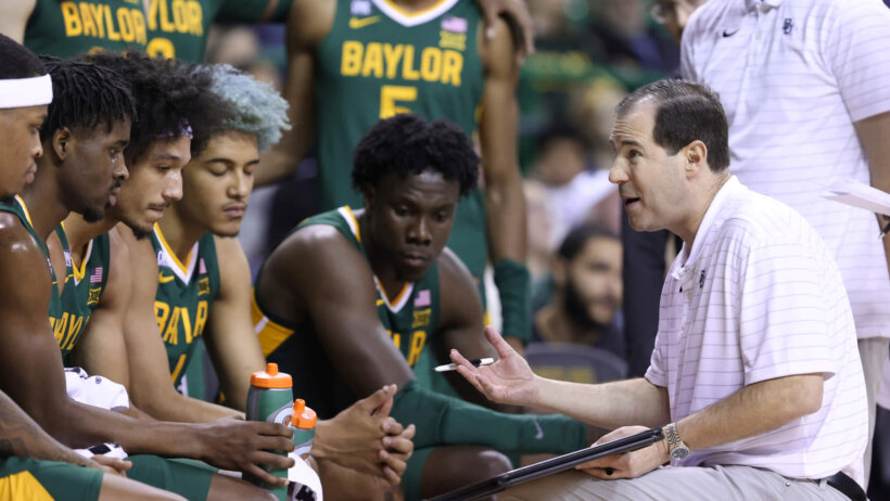 Baylor head coach Scott Drew talking to his team on the bench