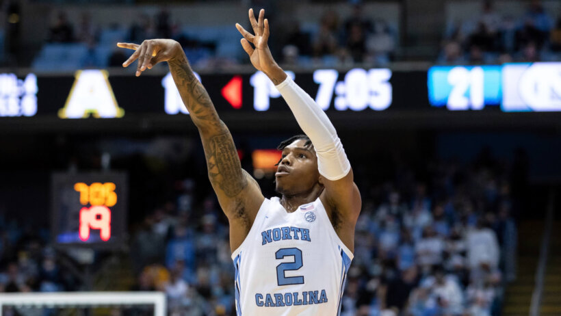 Cabel Love attempting a shot during a NCAA college basketball game.