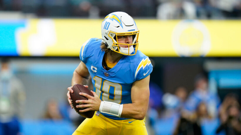 Justin Herbert rolls out of the pocket